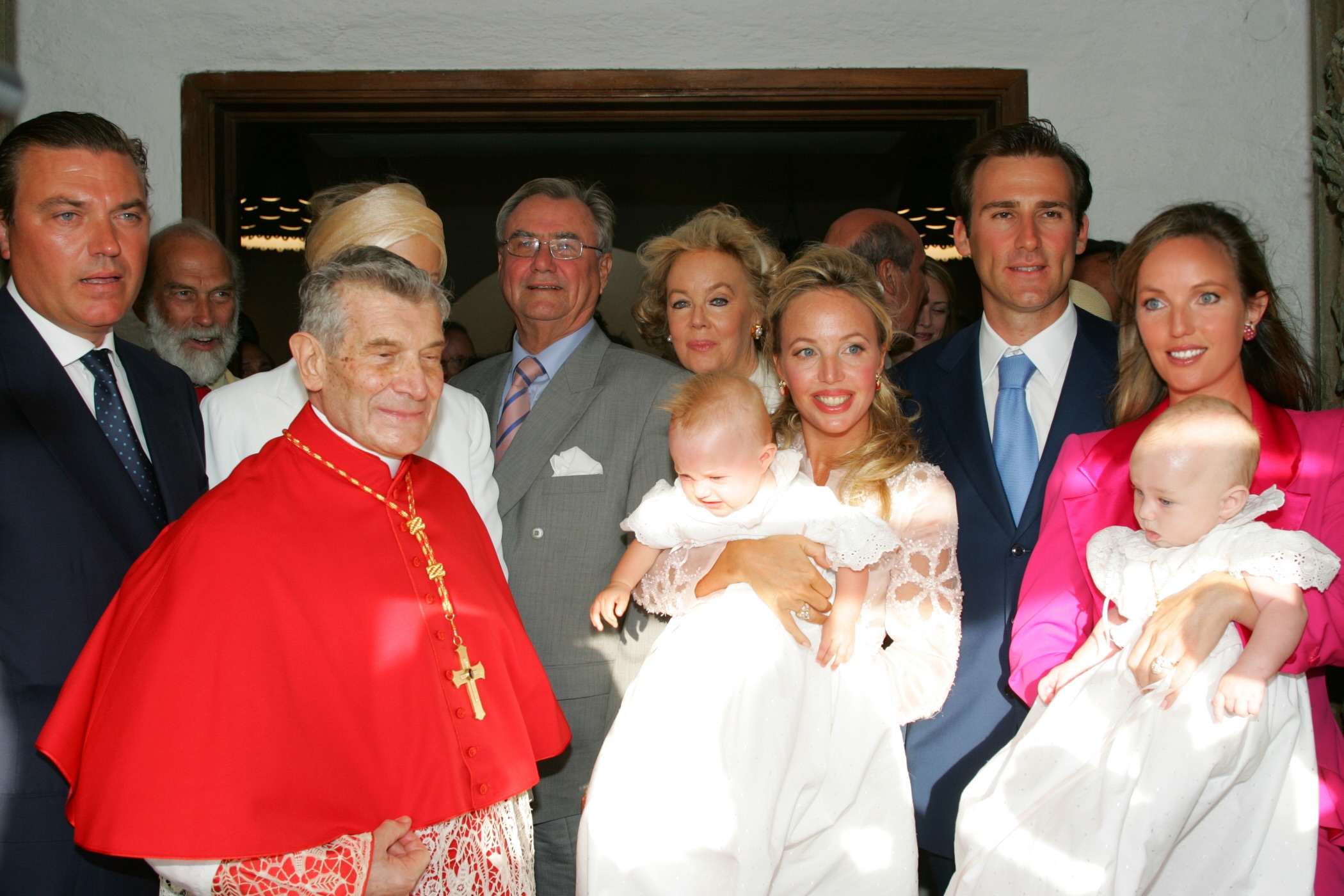 Cristie and Nicolas Delrieu with family and guests at the baptism of their daughter Delia